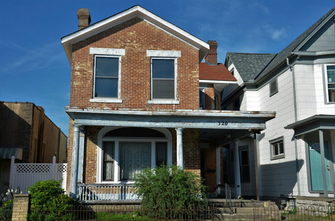 House exterior with well-maintained roof and landscape showing residential property care